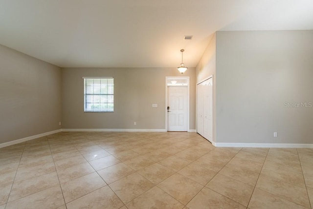 12352 Crestridge Loop, New Port Richey, FL 34655 - unfurnished room with light tile patterned flooring and baseboards