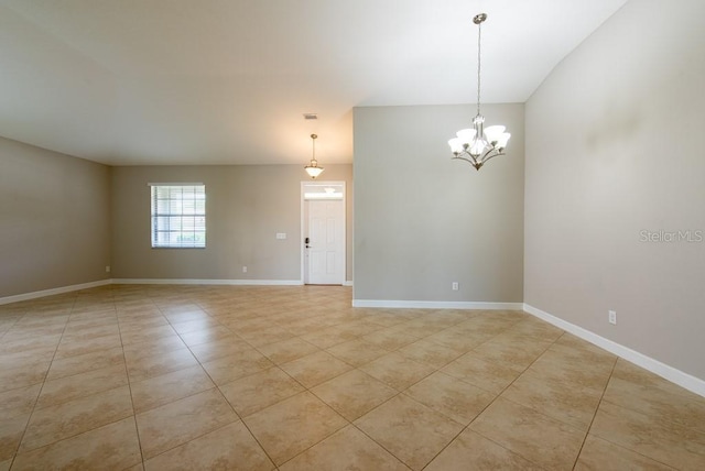 12352 Crestridge Loop, New Port Richey, FL 34655 - spare room featuring light tile patterned floors, a chandelier, and baseboards
