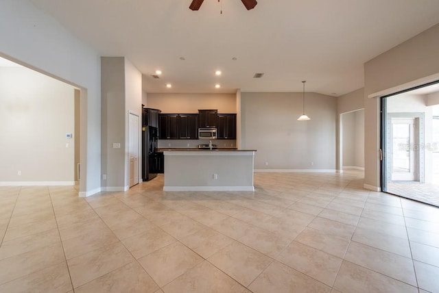 12352 Crestridge Loop, New Port Richey, FL 34655 - kitchen featuring stainless steel microwave, open floor plan, a ceiling fan, light tile patterned floors, and recessed lighting