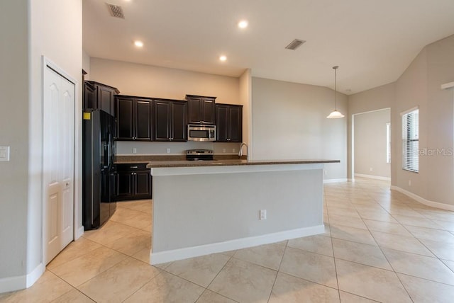 12352 Crestridge Loop, New Port Richey, FL 34655 - kitchen featuring appliances with stainless steel finishes, light tile patterned flooring, pendant lighting, a center island with sink, and recessed lighting