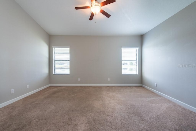 12352 Crestridge Loop, New Port Richey, FL 34655 - unfurnished room with light colored carpet, ceiling fan, and baseboards