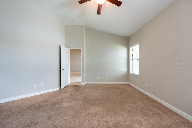12352 Crestridge Loop, New Port Richey, FL 34655 - spare room with light carpet, ceiling fan, baseboards, and high vaulted ceiling