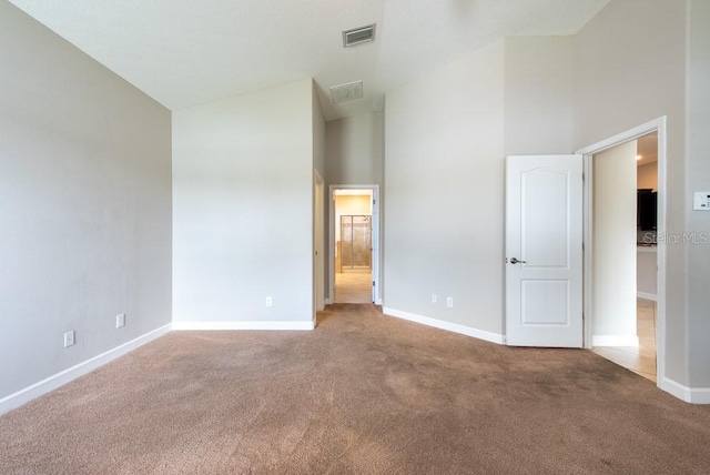 12352 Crestridge Loop, New Port Richey, FL 34655 - carpeted spare room featuring high vaulted ceiling and baseboards