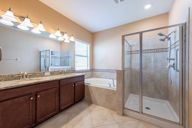 12352 Crestridge Loop, New Port Richey, FL 34655 - full bath featuring a stall shower, tile patterned flooring, a garden tub, and double vanity