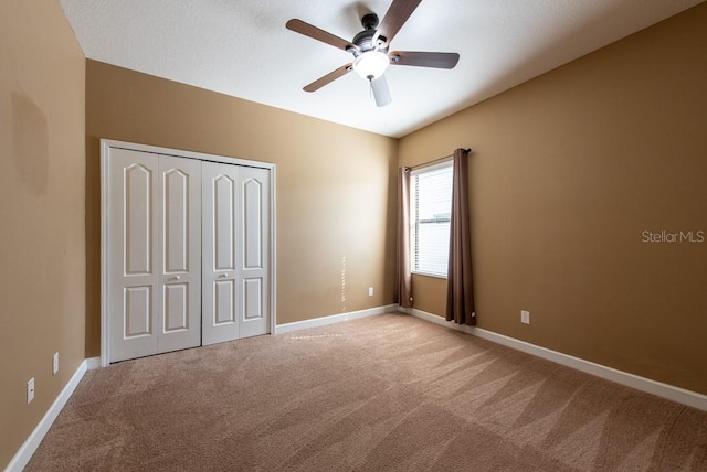 12352 Crestridge Loop, New Port Richey, FL 34655 - unfurnished bedroom with carpet, a closet, baseboards, and ceiling fan