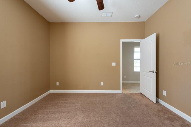 12352 Crestridge Loop, New Port Richey, FL 34655 - unfurnished room with a ceiling fan, light carpet, and baseboards