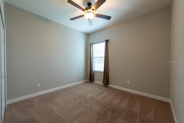 12352 Crestridge Loop, New Port Richey, FL 34655 - empty room featuring light colored carpet, baseboards, and ceiling fan