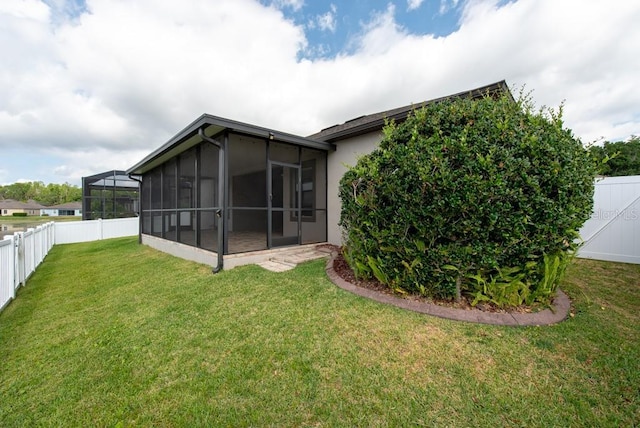 12352 Crestridge Loop, New Port Richey, FL 34655 - back of house featuring a sunroom