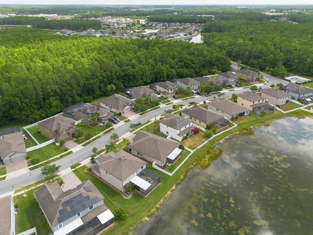 12352 Crestridge Loop, New Port Richey, FL 34655 - aerial view of residential area with a heavily wooded area and a large body of water