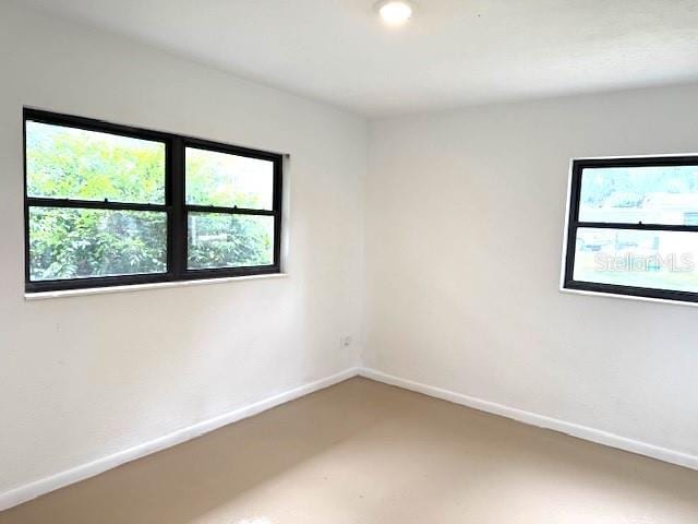 1138 Huss Rd, Wauchula, FL 33873 - spare room with plenty of natural light and baseboards