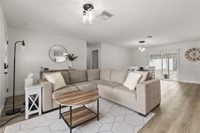 3119 W N St, Tampa, FL 33614 - living area featuring light wood finished floors and baseboards