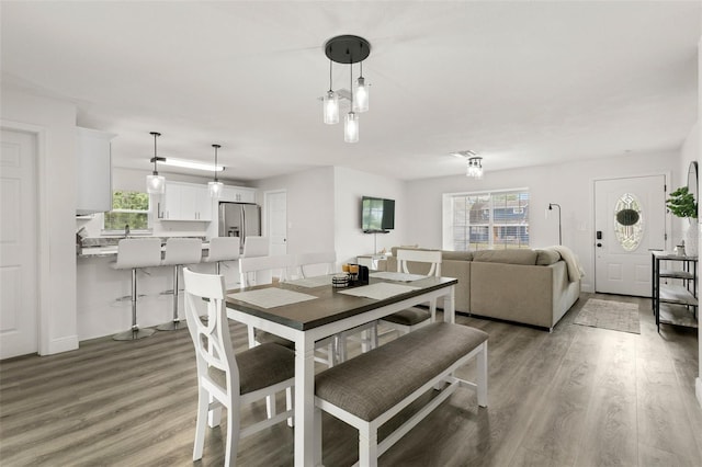 3119 W N St, Tampa, FL 33614 - dining space featuring light wood-style flooring