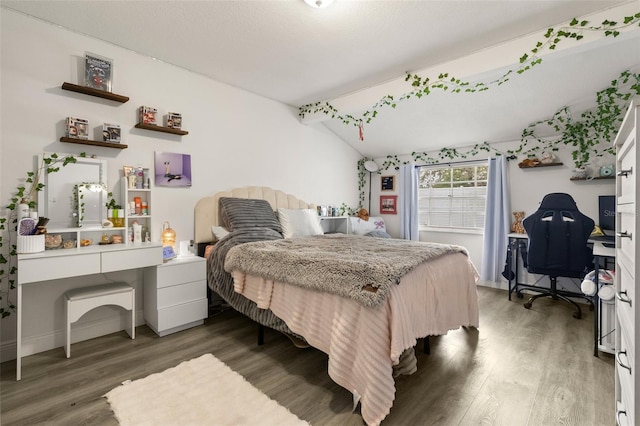 3119 W N St, Tampa, FL 33614 - bedroom with wood finished floors, lofted ceiling, and a desk