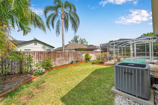 815 Sandy Trail Pl, Brandon, FL 33511 - view of yard featuring cooling unit and glass enclosure
