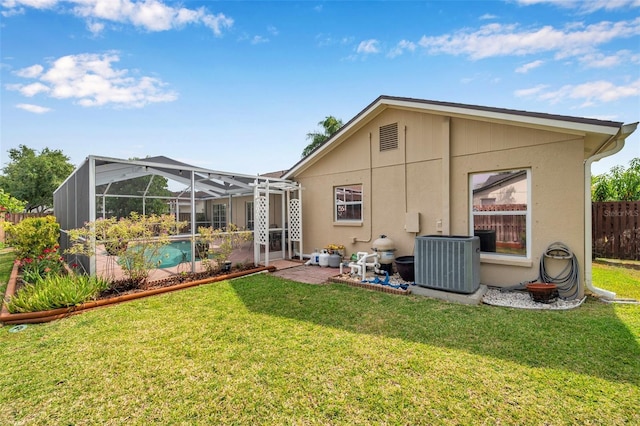 815 Sandy Trail Pl, Brandon, FL 33511 - rear view of house with cooling unit, stucco siding, glass enclosure, and a patio