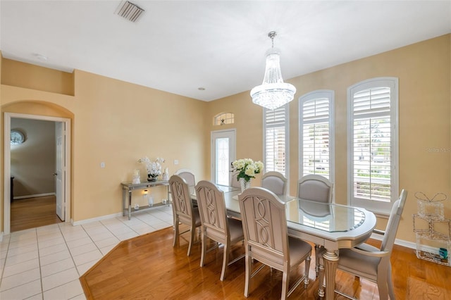 815 Sandy Trail Pl, Brandon, FL 33511 - dining room featuring a chandelier, light tile patterned floors, and baseboards