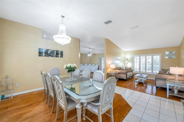 815 Sandy Trail Pl, Brandon, FL 33511 - dining area featuring wood finished floors, a chandelier, baseboards, ceiling fan, and vaulted ceiling