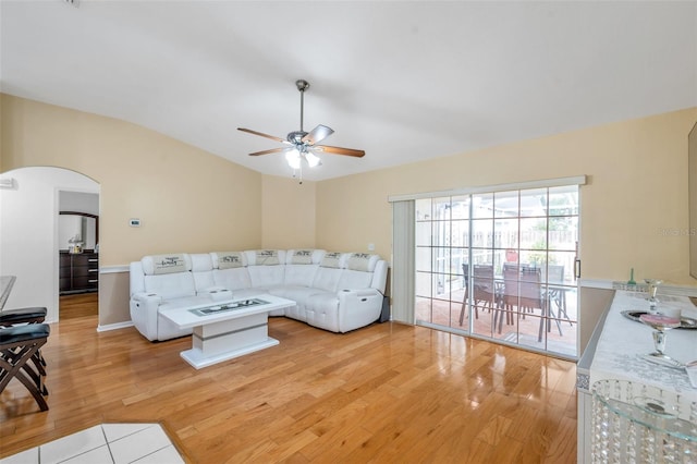 815 Sandy Trail Pl, Brandon, FL 33511 - living room featuring light wood-style floors, arched walkways, a ceiling fan, and lofted ceiling