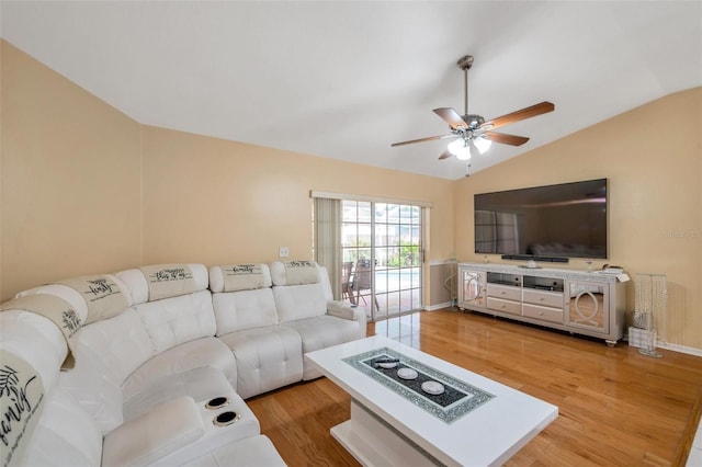 815 Sandy Trail Pl, Brandon, FL 33511 - living room with vaulted ceiling, ceiling fan, light wood-style floors, and baseboards