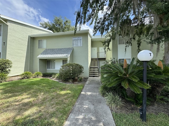 view of property featuring stairway