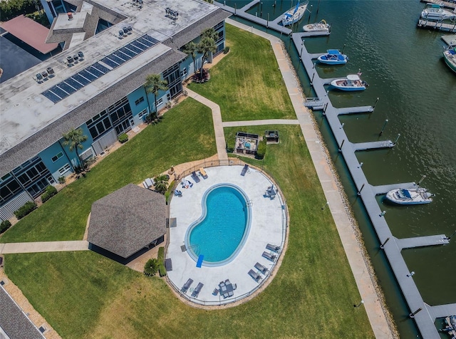 aerial view of a nearby body of water and a pool