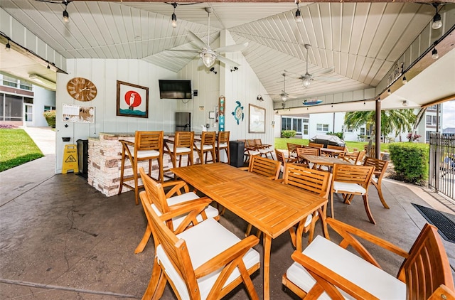 dining space featuring lofted ceiling and ceiling fan