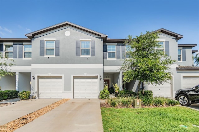 1594 Cassius St, Lutz, FL 33549 - multi unit property with a garage, stucco siding, and driveway