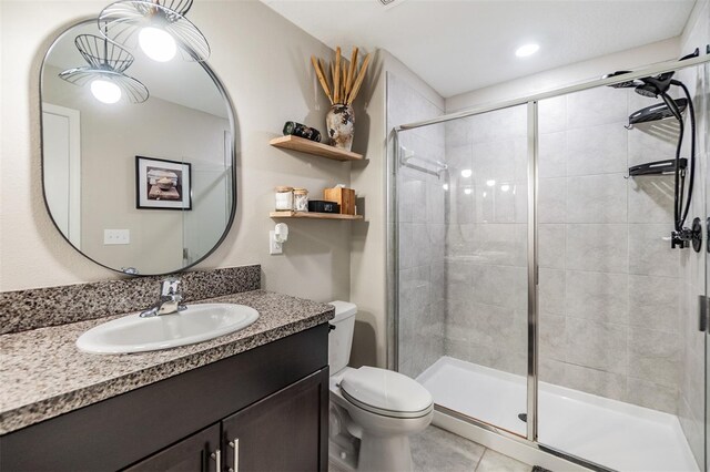 1594 Cassius St, Lutz, FL 33549 - full bath with a shower stall, toilet, vanity, and tile patterned floors