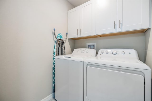 1594 Cassius St, Lutz, FL 33549 - washroom with cabinet space, independent washer and dryer, and baseboards