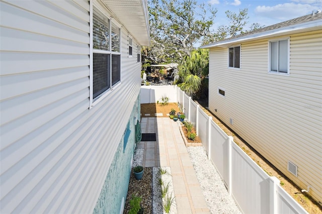 view of side of property featuring a fenced backyard