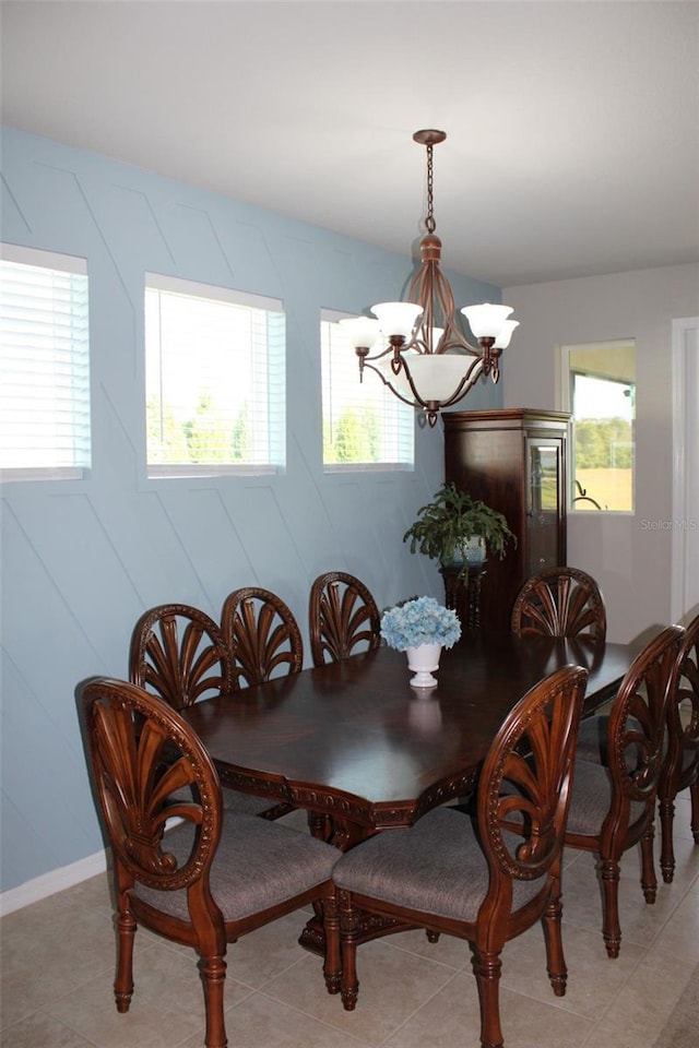 8009 Trimbelle Ter, Parrish, FL 34219 - dining space featuring a chandelier and light tile patterned floors