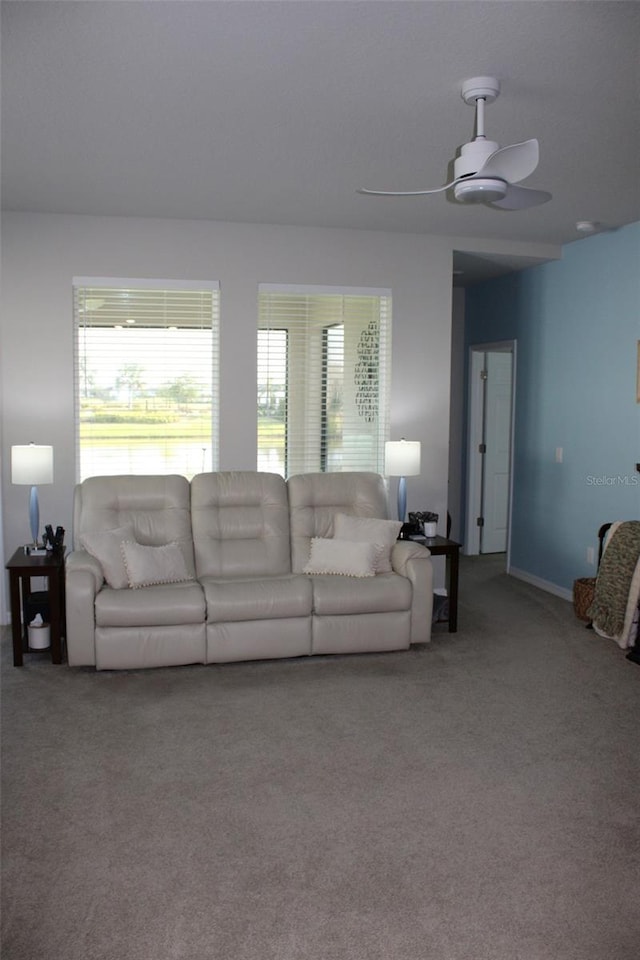 8009 Trimbelle Ter, Parrish, FL 34219 - living area featuring carpet floors, ceiling fan, and baseboards