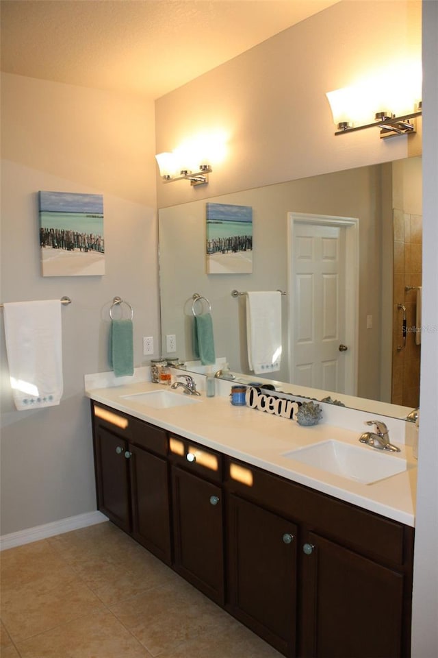 8009 Trimbelle Ter, Parrish, FL 34219 - bathroom with double vanity, baseboards, and tile patterned floors