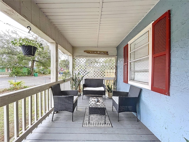 3213 E Genesee St, Tampa, FL 33610 - wooden terrace featuring an outdoor hangout area and a porch