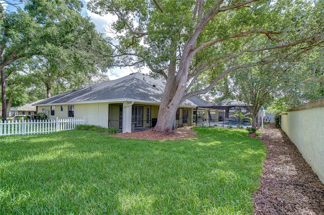 124 Barrington Dr, Brandon, FL 33511 - back of house featuring glass enclosure and roof with shingles