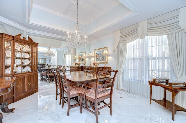 124 Barrington Dr, Brandon, FL 33511 - dining space featuring a chandelier, ornamental molding, and light marble finish flooring