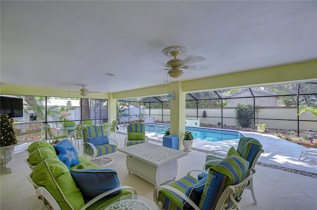 124 Barrington Dr, Brandon, FL 33511 - view of swimming pool featuring a ceiling fan, a patio area, glass enclosure, and a fenced backyard
