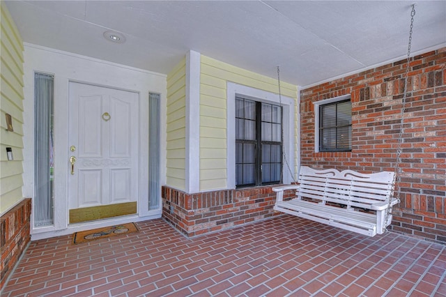 124 Barrington Dr, Brandon, FL 33511 - property entrance featuring a porch and brick siding