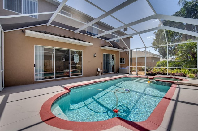 4222 Trumpworth Ct, Valrico, FL 33596 - view of pool featuring a patio, a pool with connected hot tub, and glass enclosure