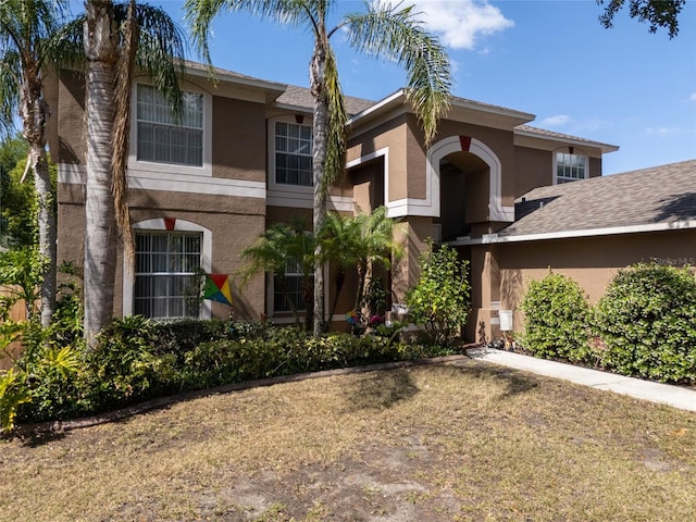 4222 Trumpworth Ct, Valrico, FL 33596 - view of front of home with stucco siding and a front lawn