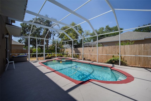 4222 Trumpworth Ct, Valrico, FL 33596 - view of swimming pool with a patio area, a fenced backyard, glass enclosure, and a pool with connected hot tub