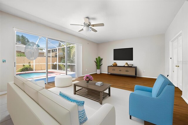4222 Trumpworth Ct, Valrico, FL 33596 - living area with ceiling fan, wood finished floors, and baseboards