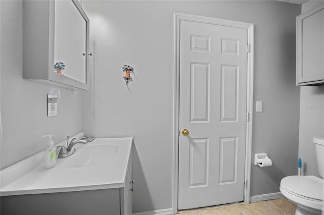 4222 Trumpworth Ct, Valrico, FL 33596 - half bathroom featuring toilet, vanity, tile patterned floors, and baseboards