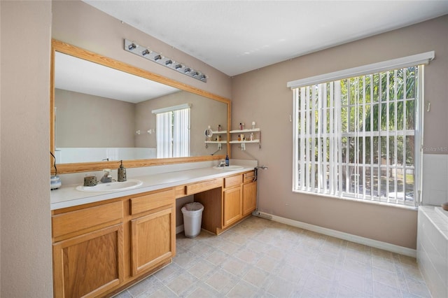 4222 Trumpworth Ct, Valrico, FL 33596 - full bathroom featuring double vanity and baseboards