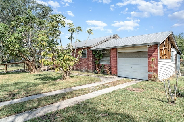 single story home with an attached garage, brick siding, driveway, and metal roof