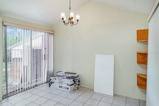 unfurnished dining area with lofted ceiling, tile patterned flooring, and a chandelier