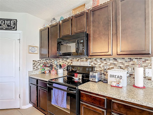 159 Lazy Willow Dr, Davenport, FL 33897 - kitchen featuring black appliances, light countertops, dark brown cabinets, and a textured ceiling