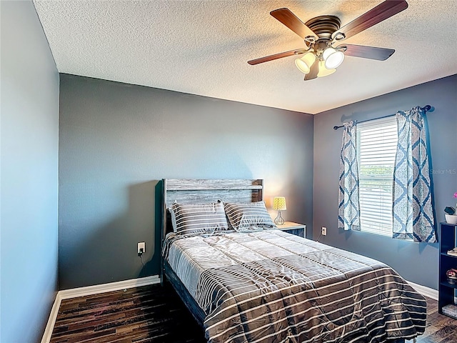 159 Lazy Willow Dr, Davenport, FL 33897 - bedroom featuring wood finished floors, baseboards, a textured ceiling, and a ceiling fan