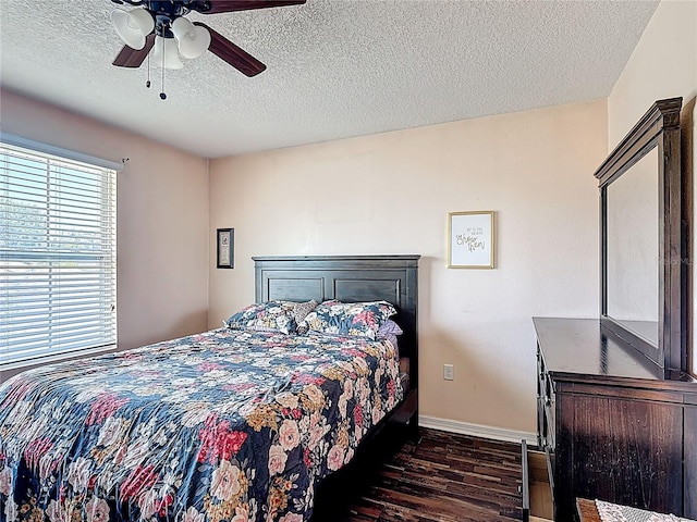 159 Lazy Willow Dr, Davenport, FL 33897 - bedroom with dark wood finished floors, a textured ceiling, baseboards, and ceiling fan