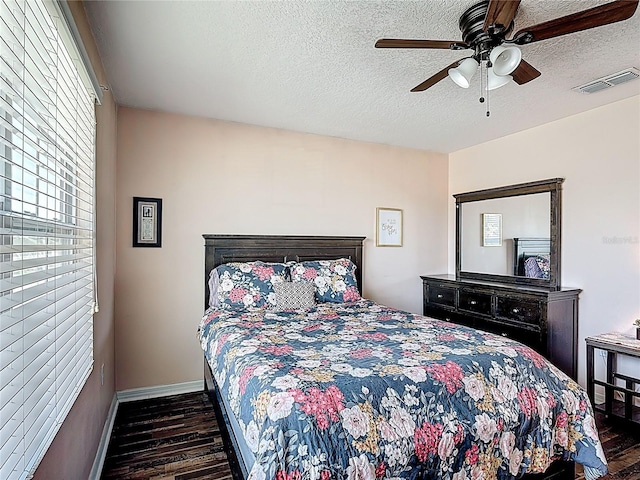 159 Lazy Willow Dr, Davenport, FL 33897 - bedroom with wood finished floors, a textured ceiling, baseboards, and ceiling fan